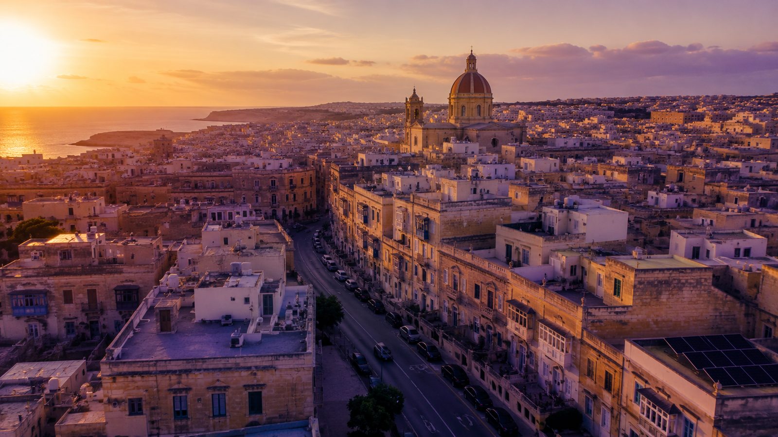 Aerial view of Malta at sunset — one compact national market for door-drop campaigns